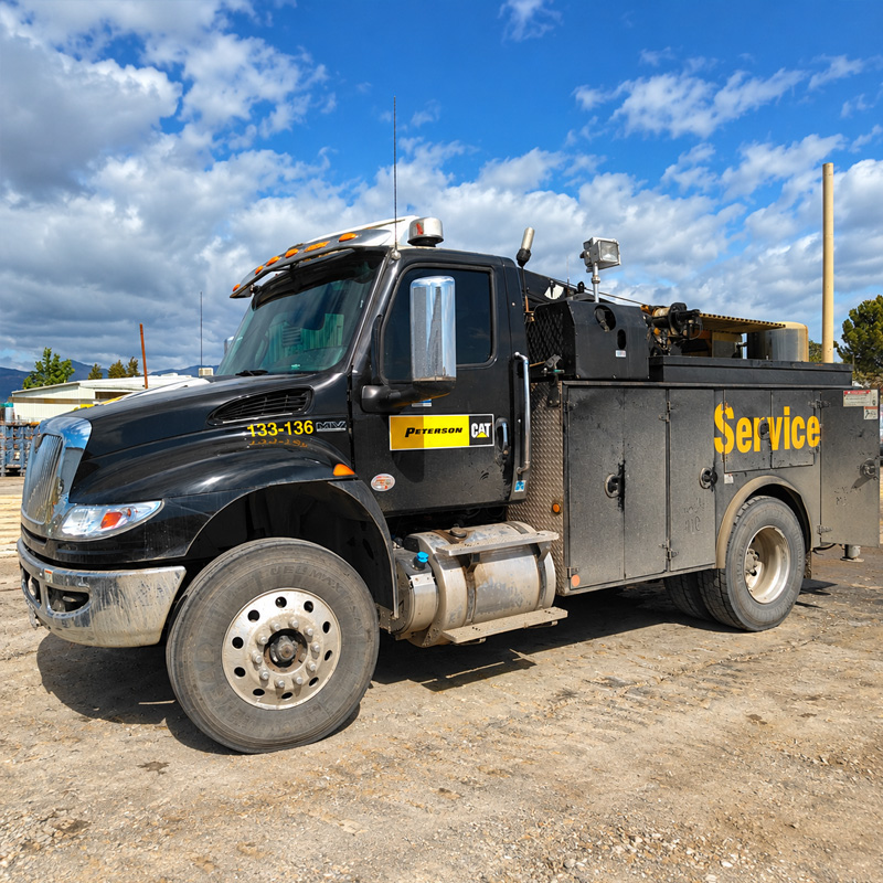 Before: black service truck covered in dust and road grime