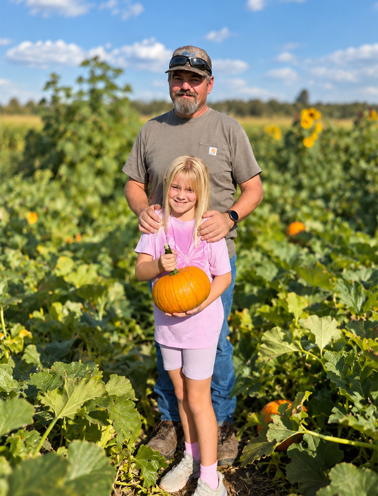 Owner Daniel Soares of S&S Mobile Pressure Washing with his daughter in a Northern California pumpkin patch