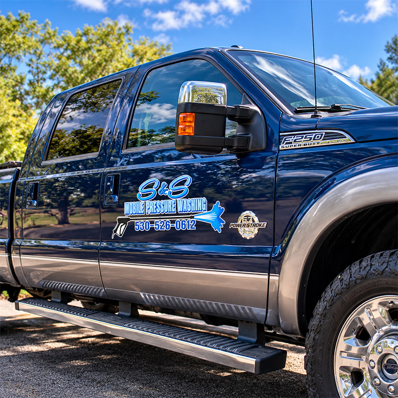S&S Mobile Pressure Washing blue Ford F-250 work truck with company logo and phone number in Redding, CA